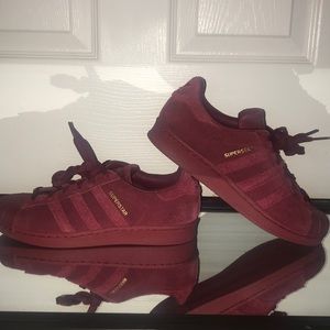 All red Adidas Superstar